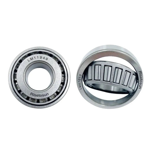 Close-up of LM11949 and LM67010 bearings from Trailer Hub And Wheel Bearing Kit For 1-1/4 Inch Axle With LM11949/10 And LM67048/10 Bearings Includes 03813TC Seals Dust Covers And Cotter Pins Two Sets For On The Road Trailer Repairs.