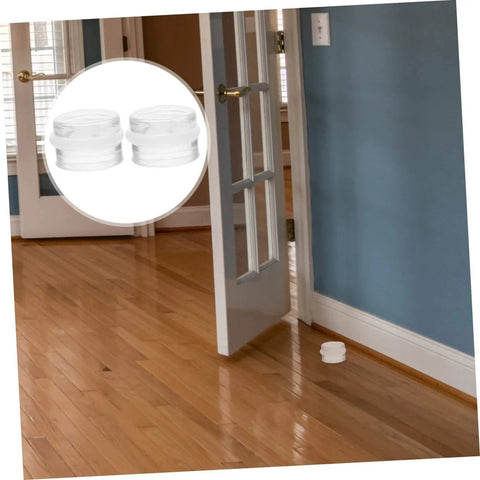 Six Piece Door Silencer And Stopper Sliding Buffer Set installed, transparent silicone wedge on hardwood floor near open door