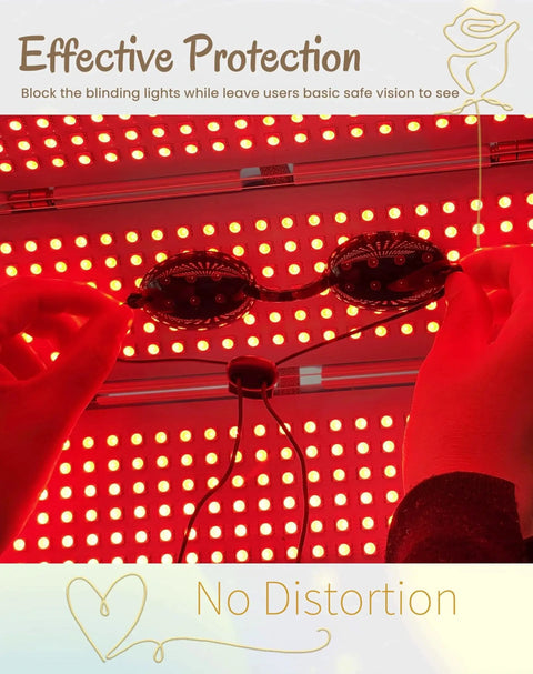 Hands holding transparent safety goggles under red light, emphasizing eye protection against bright lights.