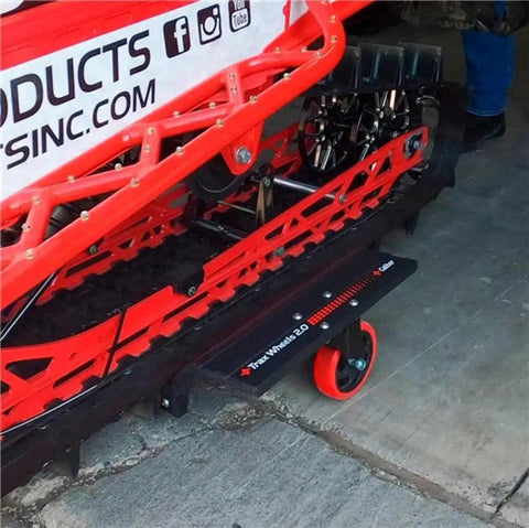 Trax Wheels 2.0 Rear Wheel Casters for snowmobiles and snow bikes installed beneath a snowmobile track, 29x16 inch castor