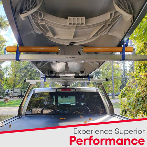 Kayak secured with polyurethane coated roller bracket on truck rack for smooth transport