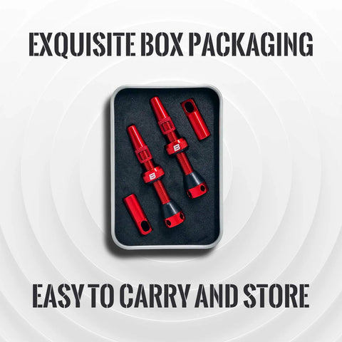 Red alloy tubeless Presta valve stems kit with core remover and caps in foam tray, pair