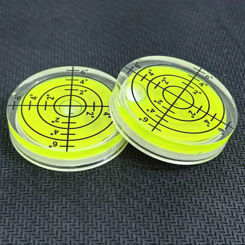 Two acrylic circular bubble levels from Three Pack Small Circular Bubble Levels 32x7mm Acrylic Round Spirit Level For Layout Tools.