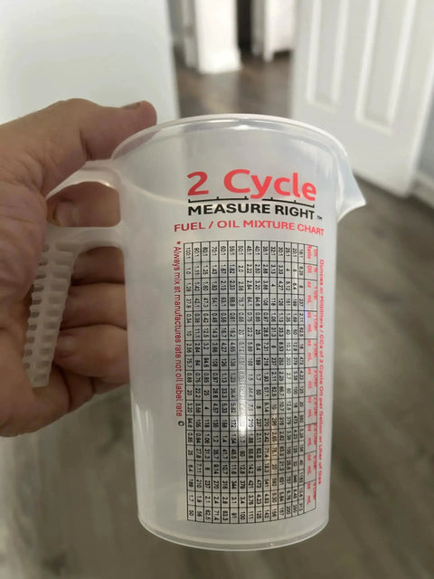 Two Stroke Oil Measuring Cup 16 Oz Mixing Pitcher With 15 In 1 Ratio Conversion Chart shown with handle and measurement markings