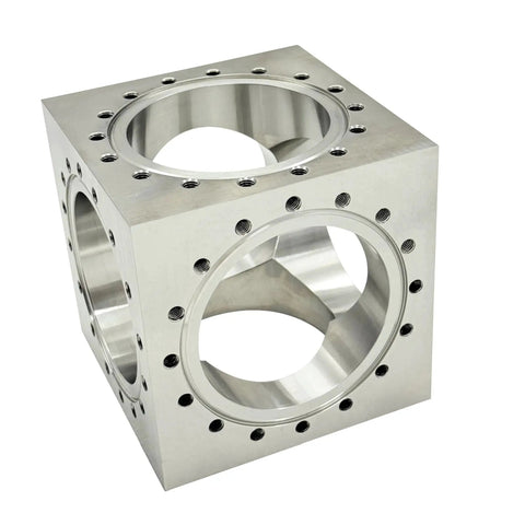 Six Channel UHV Cube Flange in 304 stainless steel with 101.6mm bore and sixteen M8 bolt holes for complex vacuum chamber layouts.