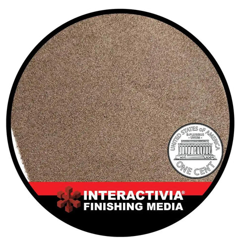 Close-up view of Ultra Fine Aluminum Oxide 8 Lbs blast media next to a penny for size comparison, by Interactivia Finishing Media.