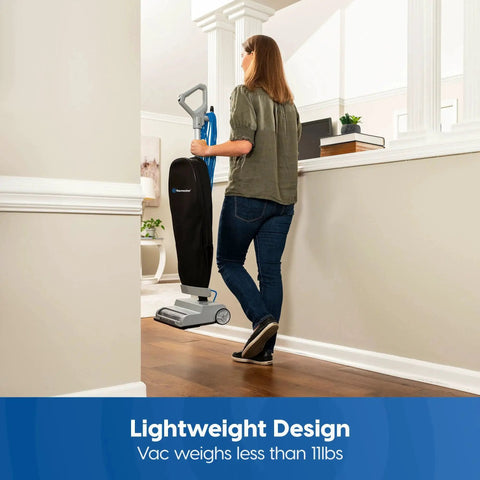 Person using Ultra Lightweight 14L Bagged Upright Vacuum Cleaner With LED Headlight And 2 Speed Settings For Pets, Carpets, Hard Floors.