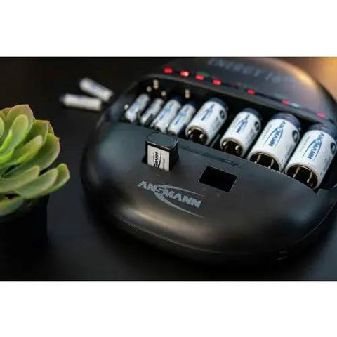 Universal Smart Battery Charger And Maintenance Station For AA AAA C D 9V USB charging C batteries on black table