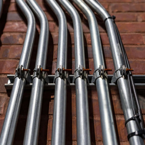 Ten-piece universal tube clamps deliver secure, corrosion-resistant support for Unistrut channels; 2 inch wall mount conduits, bolts and nuts included, galvanized steel for long lasting electrical and plumbing runs