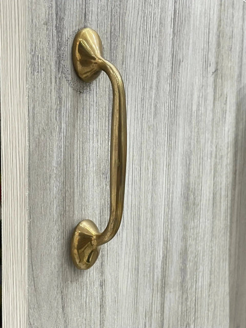 Richmond Unlacquered Brass Cabinet Pulls And Solid Brass Drawer Handles For Kitchen Cabinets And Furniture, installed on wood surface