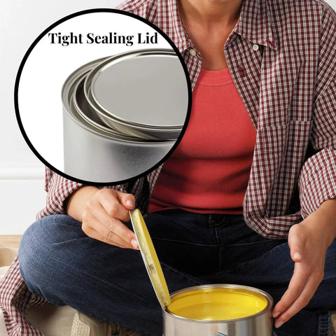 Person holding an empty quart paint can with lid, pack of 2 unlined metal cans for solvents, oil-based paints, adhesives, and crafts.