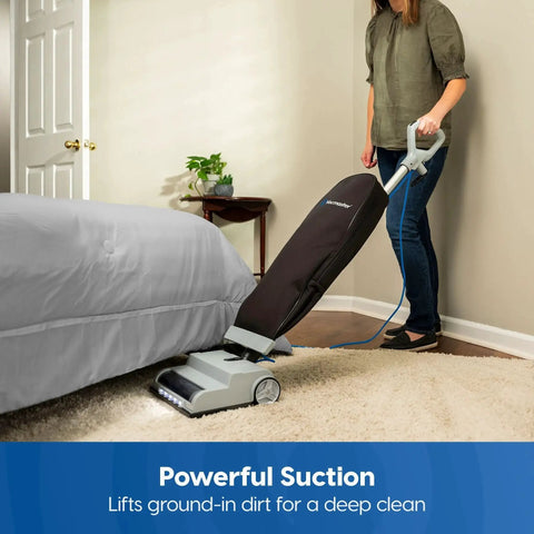 Person using Ultra Lightweight 14L Bagged Upright Vacuum Cleaner With LED Headlight And 2 Speed Settings for carpets