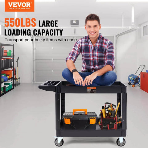 Man sitting on Heavy Duty 2 Shelf Utility Cart With 550 Lb Capacity And 360 Degree Swivel Wheels With Brakes in a garage