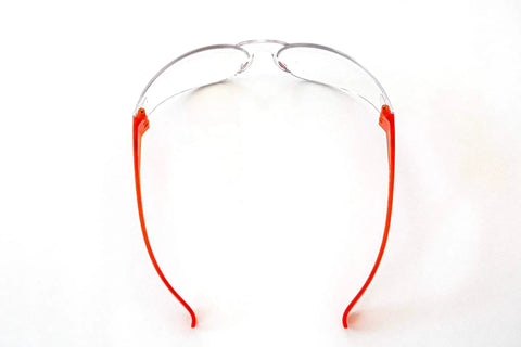 Top view of UV Protection Safety Goggles With 99 Percent UV Impact Resistant Clear Lenses featuring red adjustable temples