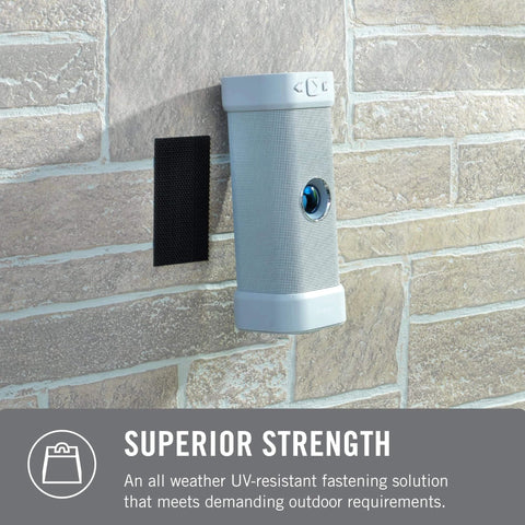 Extreme Outdoor Double Sided Mounting Tape Built To Handle Up To 15 Pounds On Brick Or Rough Surfaces UV And Weather Resistant displayed on brick wall.