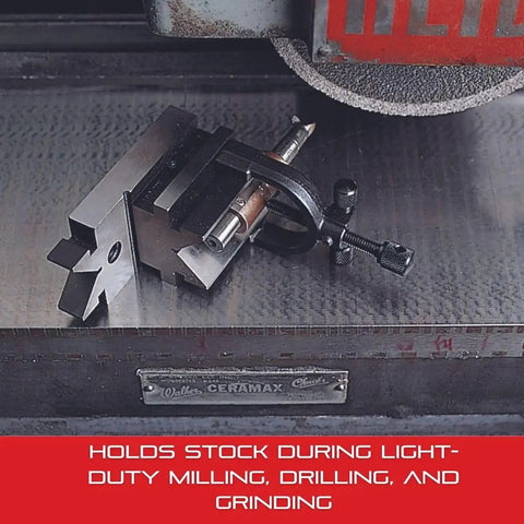 V Block And Clamp Set With Hardened Precision Ground Surfaces And Tapped Mounting Holes For Milling Drilling Grinding And Layout Work One And Five Sixteenths Inch Capacity Starrett Machinist Grade holding cylindrical workpiece on metal surface for machining.