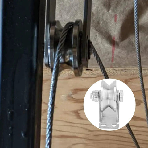 Close-up view of installed 4 Pack 2 Inch V Groove Wheel Pulley Set in 201 stainless steel with screws, supporting sliding gate cable.