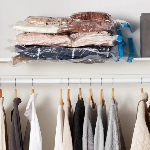 Vacuum Storage Bags For Clothes With Hand Pump, Space Saving Jumbo Compression Bags Set Of Six stacked on a shelf