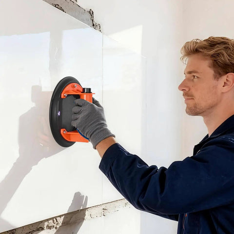 Person using an 8-Inch Heavy-Duty Vacuum Suction Cup Lifter With ABS Handle, 400 lb Max Lift Capacity for tile installation.
