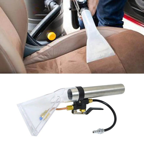 Upholstery Scrub Head Attachment For Vacuum Cleaners in use on car seat, clear scrub head with sprayed extraction nozzle for powerful cleaning.