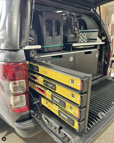 Red Universal Level Holder 4 Pack With Locking Level Mounts installed in vehicle holding yellow levels for organized storage