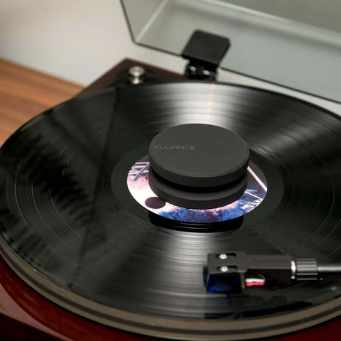 High Mass Vinyl Record Stabilizer 760 Gram Steel Weight With Anti Resonance Rubberized Coating And Protective Velvet Pad in use on turntable