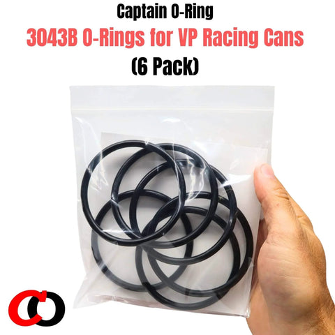 Hand holding a pack of Six Pack Replacement 3043B O Rings For VP Racing Fuels 3042 Gas Can Caps And Utility Jug Caps.
