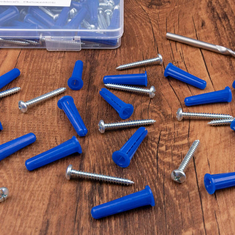 #12-16 Wall Anchors and Screws Kit 134pcs with Plastic Concrete Anchors and Galvanized Wood Screws scattered on wooden surface