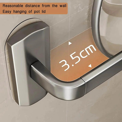 Close-up of a wall-mounted kitchen rail with hooks, showing 3.5 cm distance from wall for pot lid hanging. Kitchen Hooks Utensil Holder.