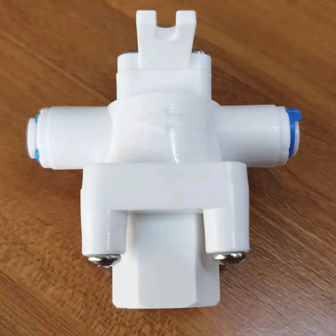 White plastic water pressure relief regulator for reverse osmosis systems with one quarter inch OD tube and quick connect fittings.