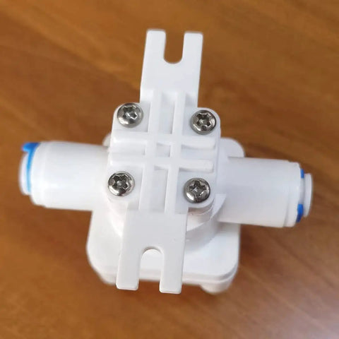 Water Pressure Relief Regulator for Reverse Osmosis Systems with 1/4 inch OD Tube, white plastic reducing valve top view