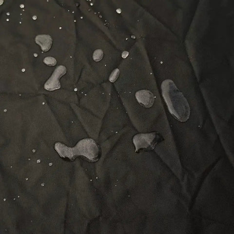 Water droplets on waterproof 420D oxford fabric, ideal for protecting top load washer from sun, dust, rain, and scratches.