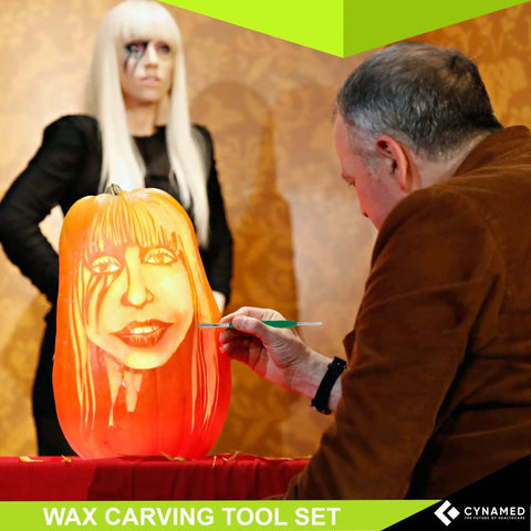 Man using Stainless Steel Spatula Wax And Clay Sculpting Tool Carver Set Pro Grade on a carved pumpkin.