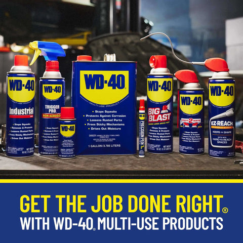 WD-40 multi-use products display including sprays and cans on a workshop table