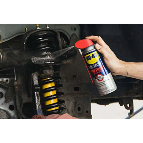 Person using WD-40 Specialist Penetrant with Smart Straw on car suspension, penetrant for metal, rubber, and plastic threads, 11 oz.