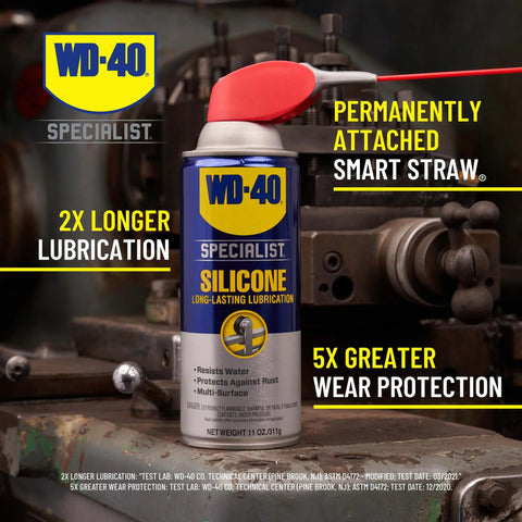 WD-40 Specialist Silicone Lubricant with SMART STRAW SPRAYS 2 WAYS, 11 OZ can with attached red straw on an industrial background.