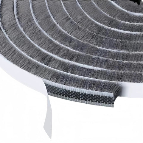 Close-up of gray self-adhesive weather stripping roll for doors/windows; white backing visible, 0.35in × 0.2in, 33 ft.