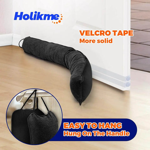 Weighted Door Draft Stopper, 36 Inch Heavy Duty Under Door Blocker With Hook And Loop Fastening, 4.5 Inch Wide Bottom Door Seal For Noise Reduction, Energy Saving, And Spill Prevention, Black installed under door with hanging view.