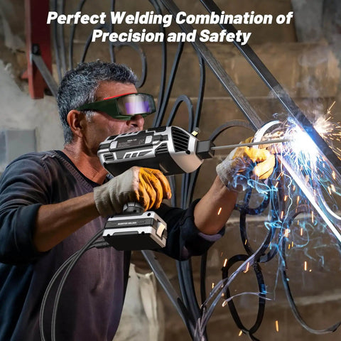 Man welding with Portable 110V Arc Welder With Auto Darkening Goggles IGBT Inverter Handheld Stick Welder in workshop