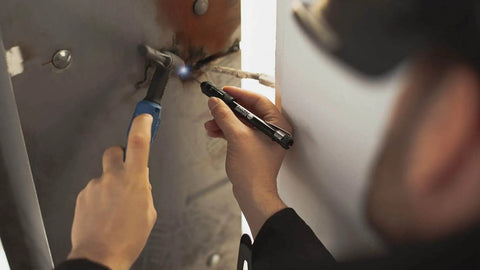 Professional TIG Welding Pen Holder With Metal Storage Case And Comfortable Grip in use during precise welding for wire feed control.