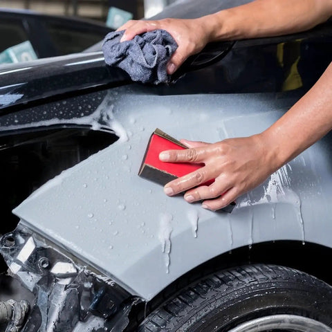 Person using Versatile Sandpaper Set With 21 Wet Dry Sheets Covering 7 Grits 120 220 400 600 800 1000 2000 for automotive sanding