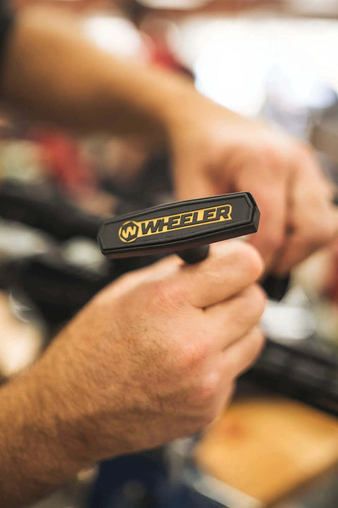 Close-up of hands using Wheeler torque wrench from Stix with 12 Screwdriver Bits, 5 Torque Limiters, and Storage Case for Firearm Building.