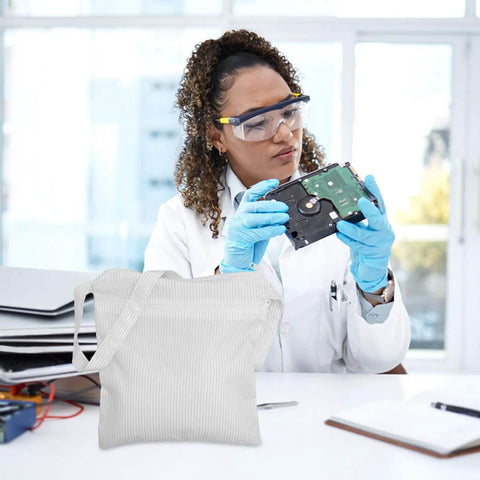 Scientist with Anti Static Tote Bag With Handles in cleanroom setting, white durable ESD dust-proof storage purse for daily garment safe storage.