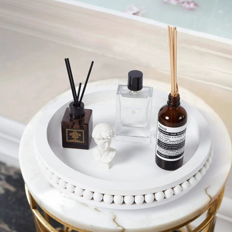 12 Inch White Beaded Lazy Susan Turntable for Tabletop and Countertop with decorative items arranged, featuring wood beaded edge.