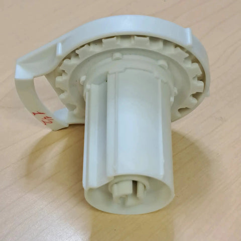 Close-up view of Clutch R Series with Bead Stopper (White, R16-1 1/2" Tube) on a wooden surface