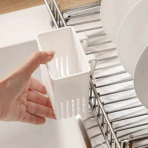 Cutlery Drying Rack - Utensil Drainer - Cutlery Drainer for Sink in white being attached to a dish rack near plates