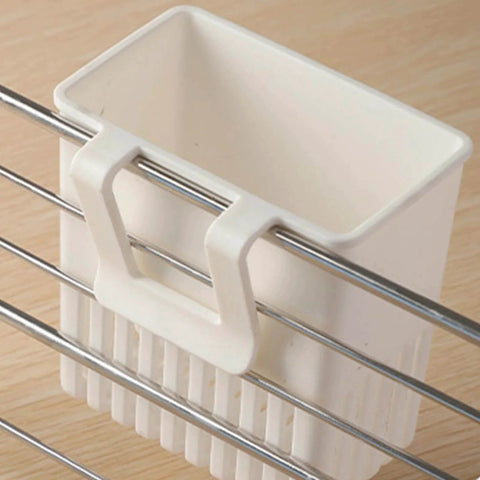 White cutlery drying rack utensil drainer clipped to metal dish rack, multi-porous design for sink storage of spoons and forks.