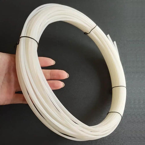 Person holding HDPE White Plastic Welding Rod 50 Feet 0.125 Inch Diameter for DIY Car Bumper Repair and other patch jobs