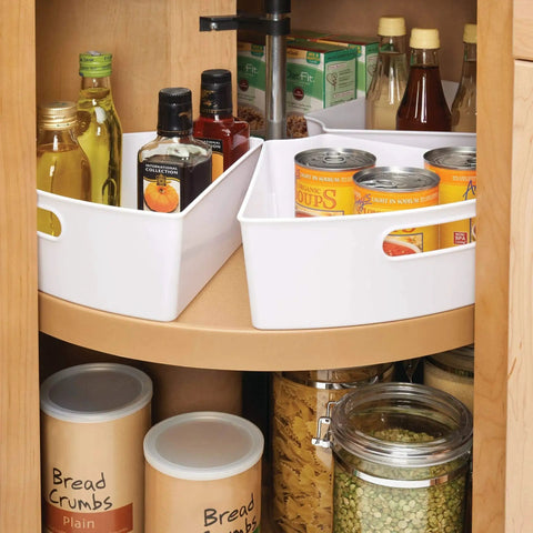 Quarter Wedge Lazy Susan Turntable Organizer With Handle In White Made From Recycled Plastic for pantry storage, filled with cans and bottles.