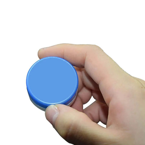 Person holding a tube of White Lithium Grease for Machinery and Gears, High and Low Temperature Resistance, Rust Prevention